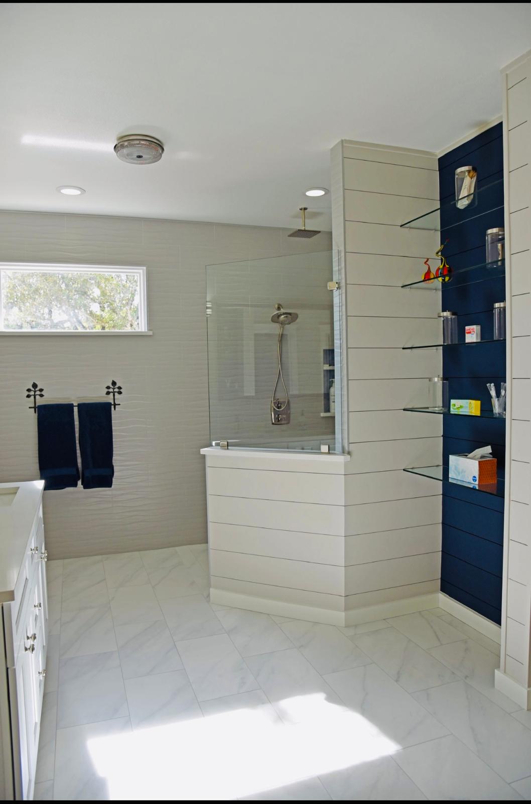 Modern bathroom with navy blue shelving San Antonio